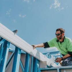 Parrish Group: roofing specialist inspecting new roof structure.