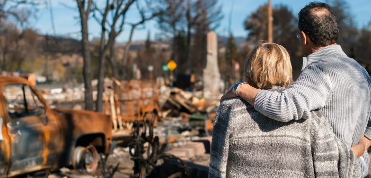 Couple surveys damage after bushfire destroys home